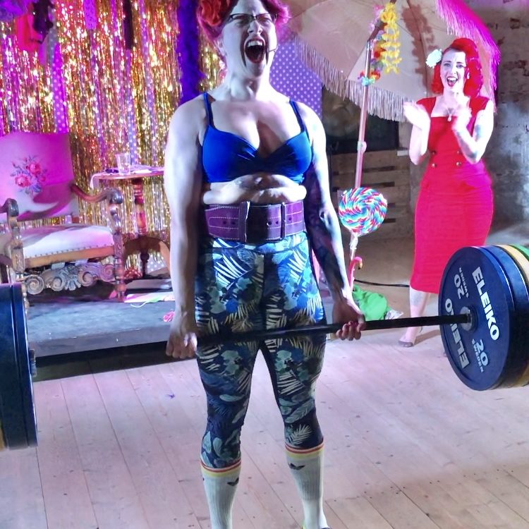 Deadlifting in a barn Strong girl deadlifting